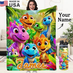 May include: A colorful blanket and water bottle featuring cartoon dinosaurs. The blanket has a vibrant design with various dinosaurs and the name "James" in a playful font. The water bottle also displays the dinosaur theme.