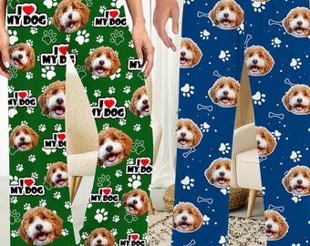 May include: A pair of green and blue pajama pants with a repeated pattern of a dog's face and the text "I love my dog".