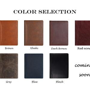 May include: Color selection chart for a leather bound journal. The colors shown are brown, khaki, dark brown, red wine, grey, blue, and black. The text "coming soon" is displayed below the black journal.