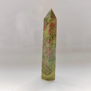 May include: A set of three ceramic mugs with a speckled, matte finish. The mugs are in shades of cream, light gray, and dark gray. Each mug has a simple, minimalist design, perfect for coffee or tea.