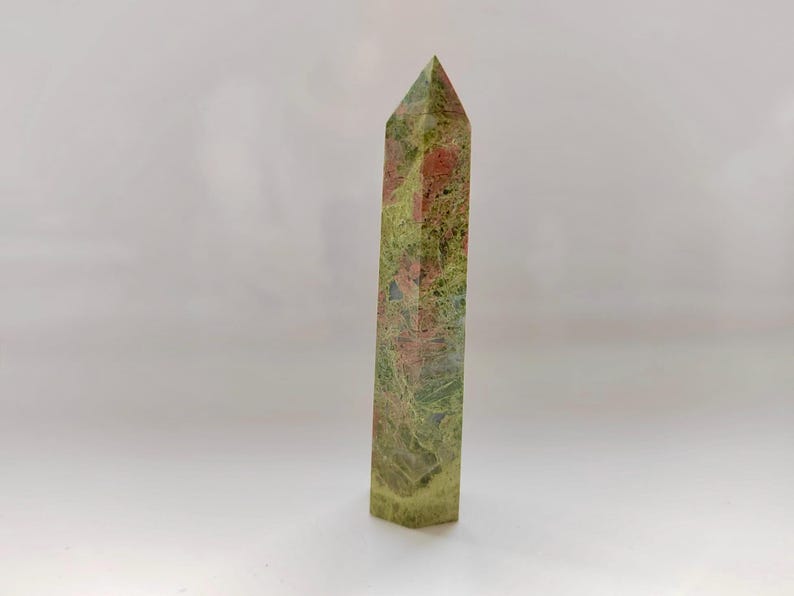 May include: A set of three ceramic mugs with a speckled, matte finish. The mugs are in shades of cream, light gray, and dark gray. Each mug has a simple, minimalist design, perfect for coffee or tea.