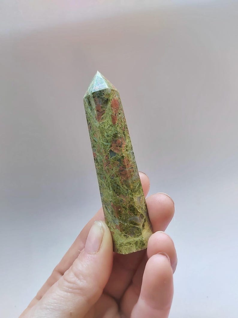 May include: A set of three ceramic mugs with a speckled, matte finish. The mugs are in shades of cream, light gray, and dark gray. Each mug has a simple, minimalist design, perfect for coffee or tea.