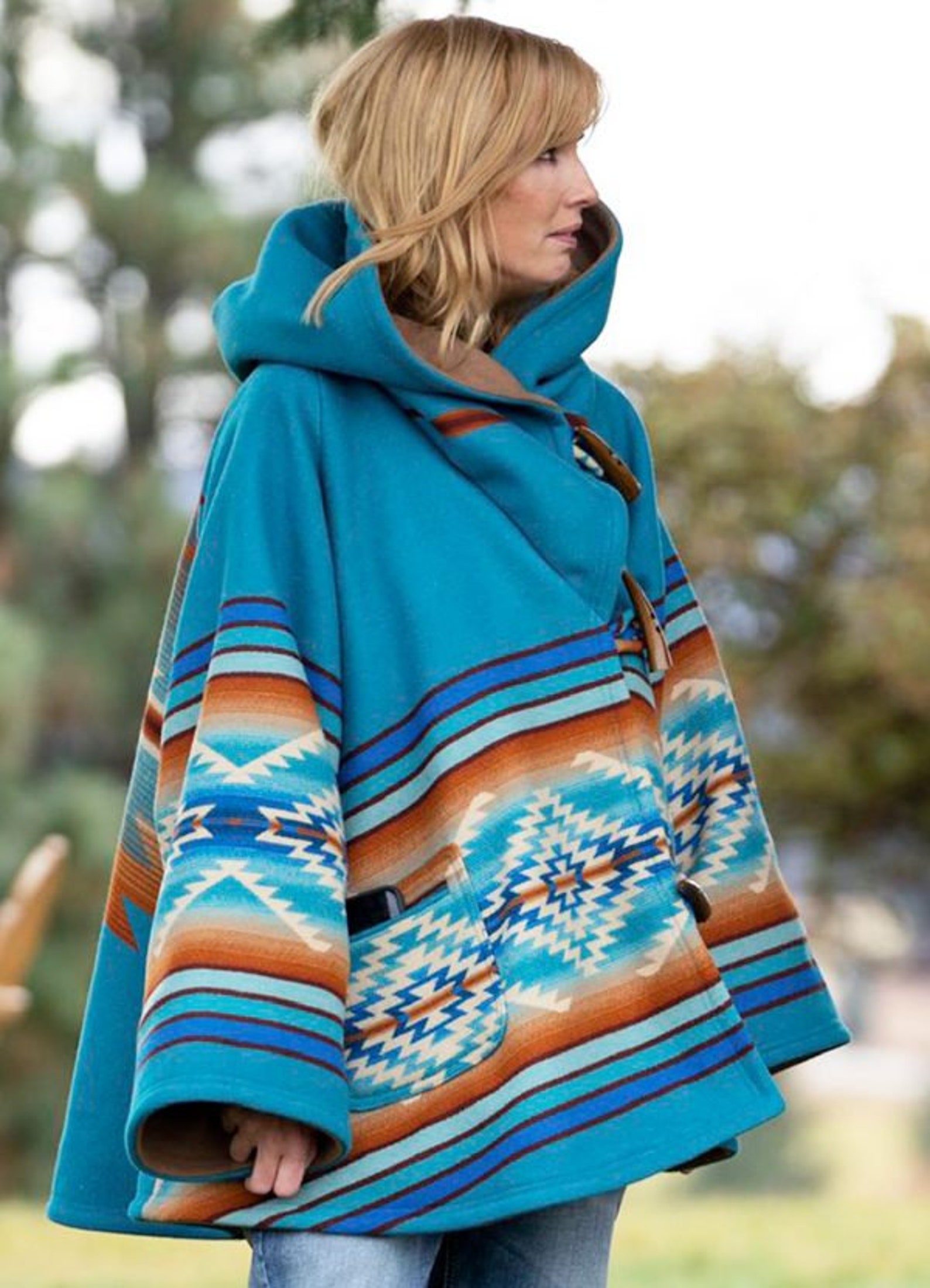 beth's blue poncho on yellowstone