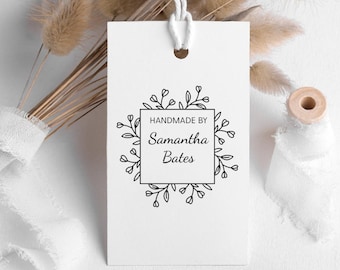 May include: White tag with black text and a floral border. The text reads "Handmade by Samantha Bates".