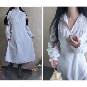 Vintage white nightgown with long sleeve and lace collar and floral embroidery. Victorian medieval style. Medium size