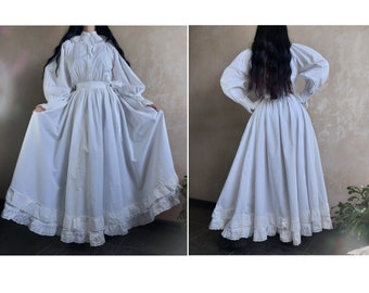 Vintage white cotton maxi dress with puffy sleeves, ruffles, lace collar and bow belt. Victorian ball gown. Bridal / Wedding