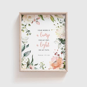 May include: A framed print with a floral design and a quote from Psalm 119:105: "Your word is a lamp for my feet, a light on my path."