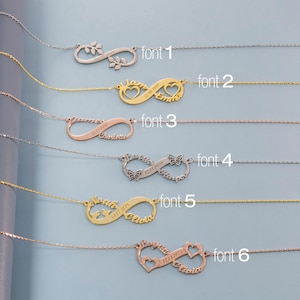 May include: Six infinity symbol necklaces with different fonts and designs. Each necklace has a different inscription, including names and dates. The necklaces are displayed against a light blue background.