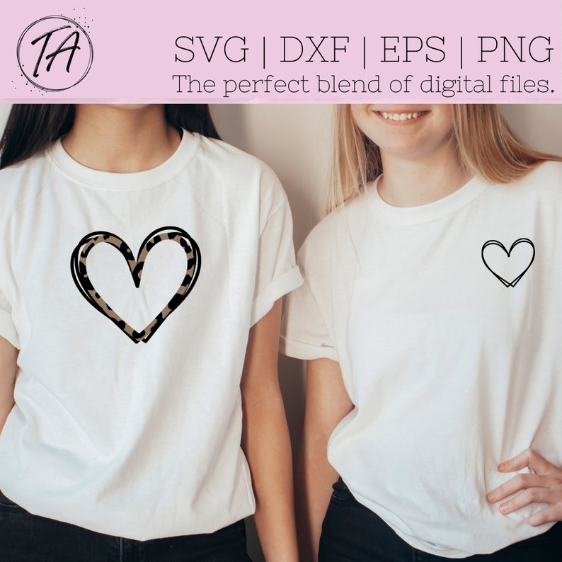May include: Two white t-shirts with a black outline heart design. One heart is filled with a leopard print pattern.