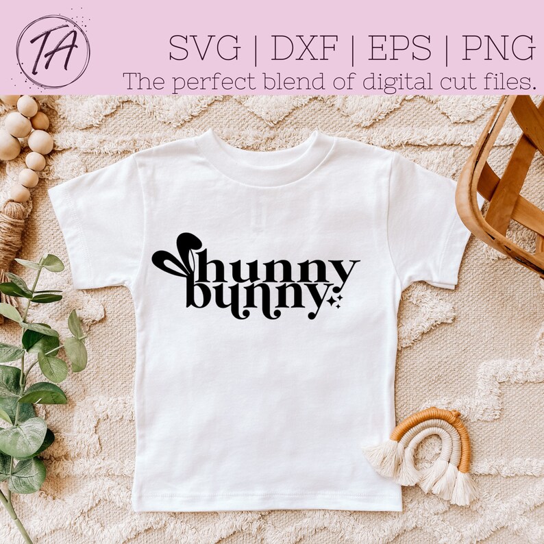 May include: White t-shirt with a black graphic that says "hunny bunny" with a stylized bunny ear design.