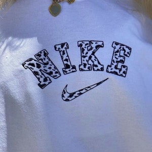 nike cow crewneck