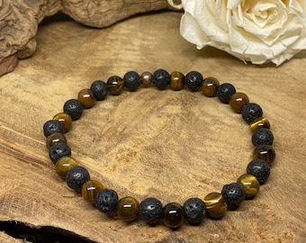 Puede incluir: Un brazalete de cuentas marrones y negras con cuentas de ojo de tigre y lava.