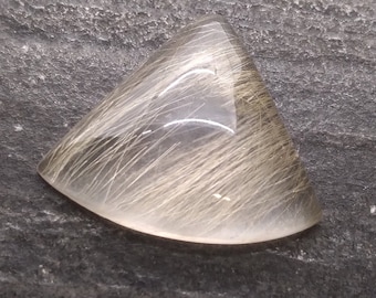 Rutilated Quartz cabochon.  Golden needles of rutile.