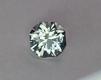 Danburite.  Custom cut in Colorado.  New design. Faceted loose.  Bright and highly reflective gemstone.  Cushion cut.