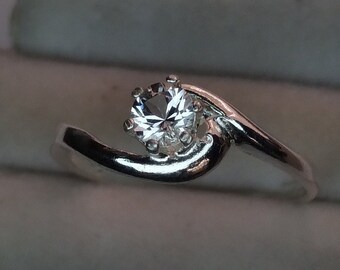 4mm danburite solitaire silver ring.  Size 7. Very beautiful, bright and well cut clear gemstone.