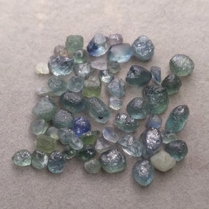Facet grade Montana sapphire.  Gem rough from rock creek Montana.  LOT of 54 pieces