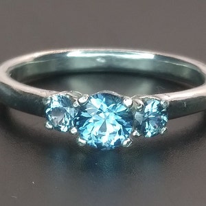 Montana sapphire ring.  Rock creek Montana sapphires.  Sterling silver ring. 4.5mm main sapphire.  3mm side sapphires.