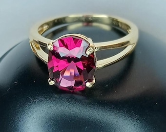 Umbalite garnet set in 14k yellow gold ring.  10x8mm oval at 3.53ct. Custom cut in Colorado.  Precision cut gemstone.  Fine jewelry.