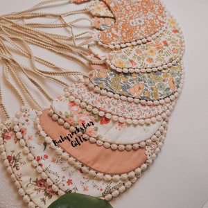 Handmade Organic Cotton Baby Bib: Reversible Pom Pom Trim