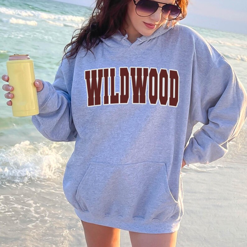 May include: A gray hooded sweatshirt with the word "WILDWOOD" printed in maroon letters across the front.
