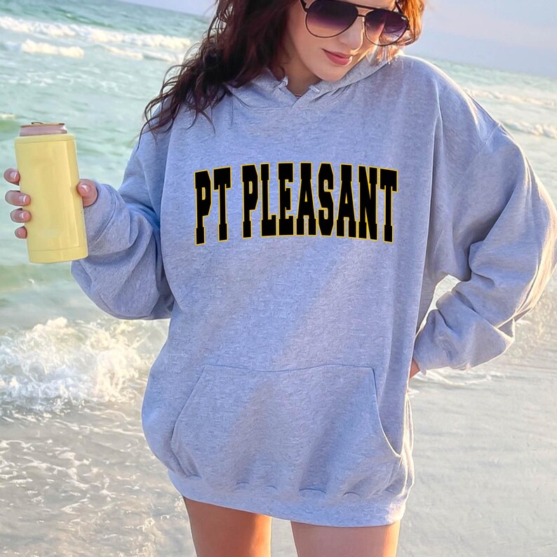 May include: A gray hooded sweatshirt with the text "PT PLEASANT" in black letters with a yellow outline.