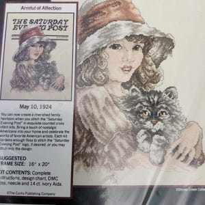 Puede incluir: Kit de punto de cruz con una niña y un gato, inspirado en una portada vintage de "Saturday Evening Post". Incluye hilo, aguja y tela Aida de 14 ct. Tamaño de marco sugerido: 40.6 cm x 50.8 cm.