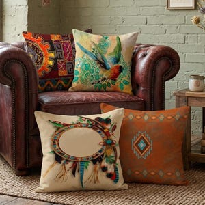 May include: A brown leather armchair with several decorative throw pillows. Pillows feature various designs, including a bird, geometric patterns, and a dreamcatcher. The room has a rustic aesthetic with a brick wall and framed artwork.