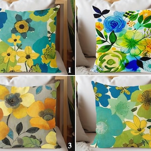 May include: Four different floral patterned pillow covers. The patterns feature yellow, blue, green, and white flowers on a variety of backgrounds.