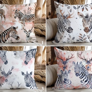 May include: Decorative throw pillows with watercolor illustrations of zebras and deer. The pillows feature a neutral color palette with pink and brown accents. The designs vary, showcasing different arrangements of the animals and foliage.