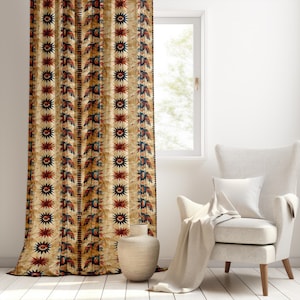 May include: Beige curtain featuring a repeating pattern of red, blue, and black starburst and leaf designs. The curtain hangs in front of a window, with a white chair and vase in the room. The curtain is made of a thick fabric.