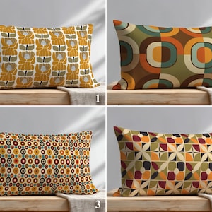 May include: Four rectangular cushions with retro patterns. The cushions feature designs with flowers, geometric shapes, and circles in shades of yellow, brown, orange, and green. They are displayed on a wooden surface.