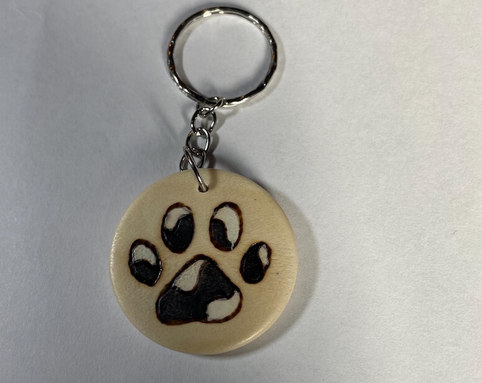 Dog print Wood burnt and painted by hand keychain!