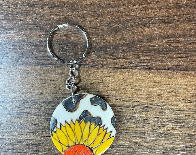 Sunflower and cowprint Wood burnt and painted by hand keychain!