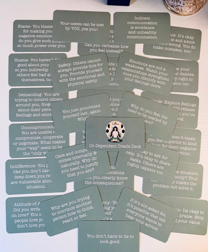 May include: A set of green cards with white text, each card features a different affirmation or question related to codependency. The cards are designed to help individuals explore their relationships and identify unhealthy patterns.