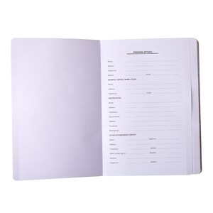 May include: An open notebook with blank pages on the left and a page with "PERSONAL DETAILS" and contact information fields on the right. The fields include name, address, phone, and emergency contact details.