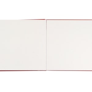 May include: A blank, white sketchbook with a red cover. The book is open to a fresh, blank page.