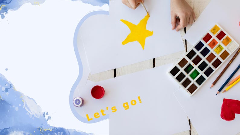 May include: A child's hand paints a yellow star on a white sheet of paper. A set of watercolour paints and coloured pencils are on the table. The paper also has the words "Let's go!" written in yellow.
