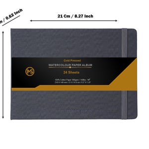 May include: A grey watercolour paper album with a black and gold label. The label says "Cold Pressed Watercolour Paper Album, 24 Sheets". The album measures 21 cm by 14.8 cm.