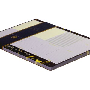 May include: A black and gold notepad with the words "WEEKLY PLANNER" on the front. The notepad has a lined interior and is perfect for organizing your week.