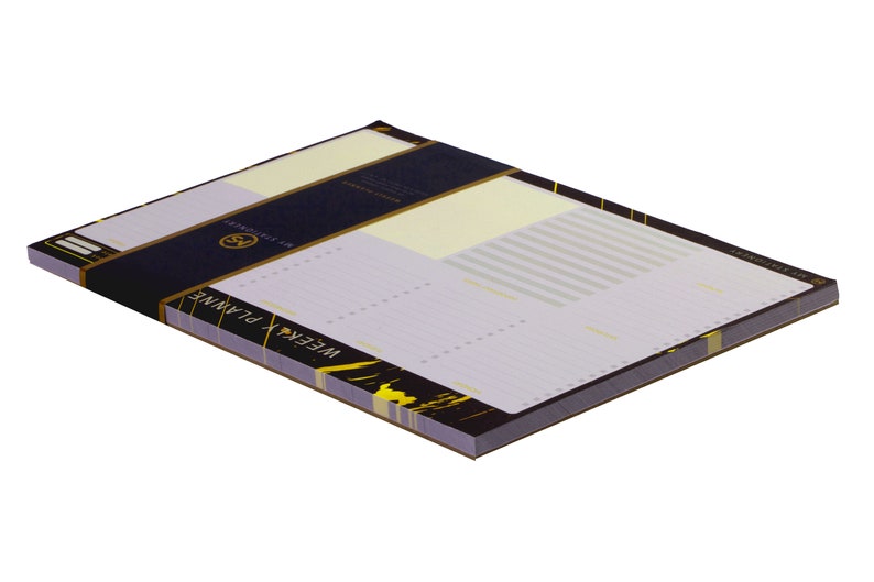 May include: A black and gold notepad with the words "WEEKLY PLANNER" on the front. The notepad has a lined interior and is perfect for organizing your week.