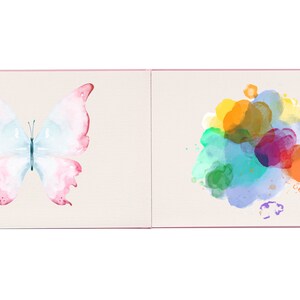 May include: An open book with a watercolor butterfly on one page and a colorful watercolor splatter on the other page.