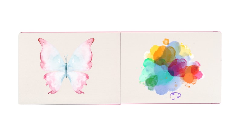 May include: An open book with a watercolor butterfly on one page and a colorful watercolor splatter on the other page.