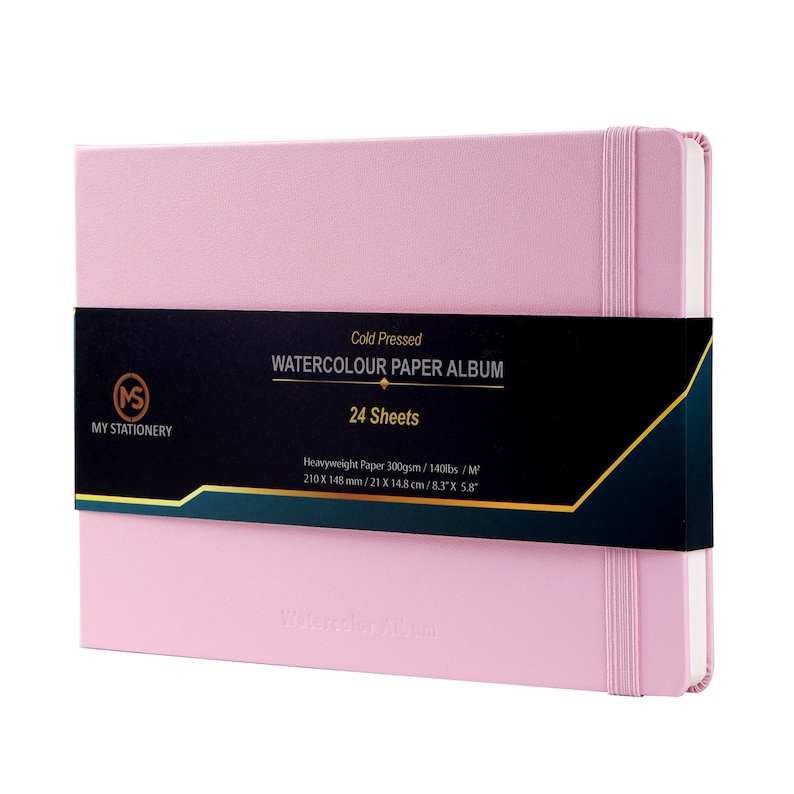 May include: A pink watercolor paper album with a black label that reads "Cold Pressed Watercolor Paper Album 24 Sheets". The label also includes the dimensions of the paper: 8.3" x 5.8".