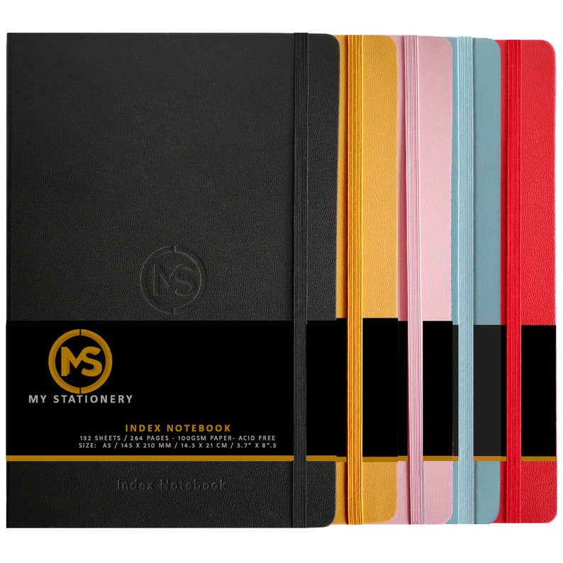May include: A collection of index notebooks in various colors, including black, yellow, pink, blue, and red. Each notebook has a matching elastic band and a debossed logo. The notebooks are A5 size, measuring 5.7" x 8.3". The text "MY STATIONERY" and "INDEX NOTEBOOK" are visible.