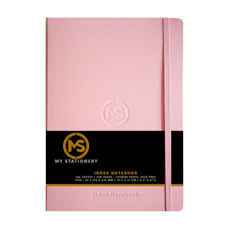 May include: A pink A5 index notebook with a matching elastic closure. The cover features a debossed logo and the text "MY STATIONERY" and "INDEX NOTEBOOK" on a black band. The notebook contains 104 sheets of acid-free paper.