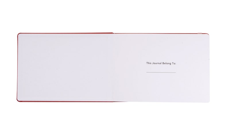 May include: A red journal with a blank page open to the inside cover. The inside cover has the text "This Journal Belong To:" printed on it.