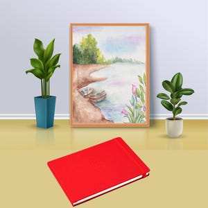 May include: A red hardback journal with a subtle embossed design. The journal is sitting on a light brown surface in front of a framed watercolour painting of a lake scene with boats and flowers.