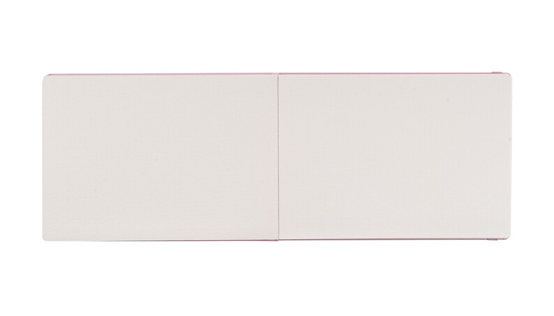 May include: A blank, white, two-page, pink-edged, hardcover notebook.