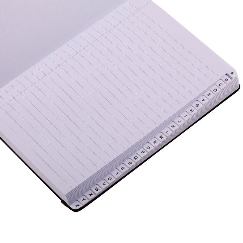 May include: Open address book with lined pages and alphabetical tabs. The black-bound book is open to a blank page with horizontal lines. The tabs are labeled A through Z, providing easy organization for contacts.