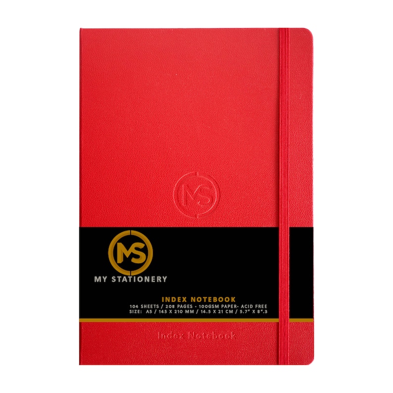 May include: A red A5 index notebook with a matching elastic closure. The cover features a debossed "MS" logo and a black band with the text "MY STATIONERY" and "INDEX NOTEBOOK". The notebook contains 104 sheets of acid-free paper, measuring 5.7" x 8.3".